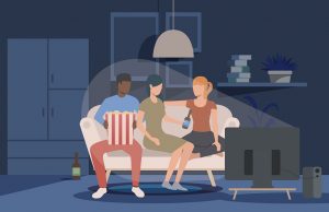 Friends watching movie at home