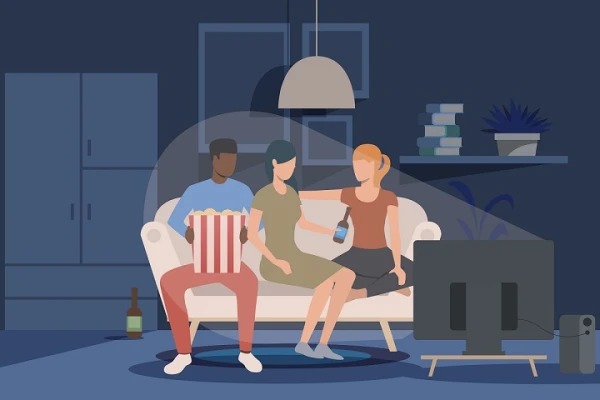 Friends watching movie at home