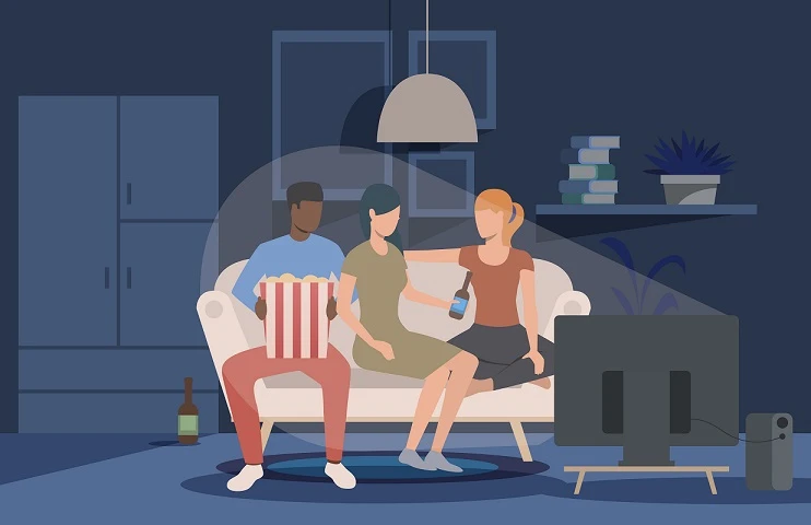 Friends watching movie at home