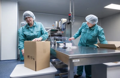 Pharmaceutical factory workers in sterile environment
